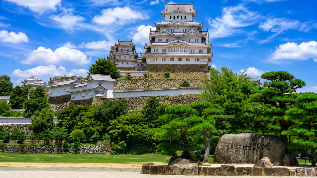 The white keep of Himeji Castle above its stone walls on a day tour from Osaka, Osaka Japan