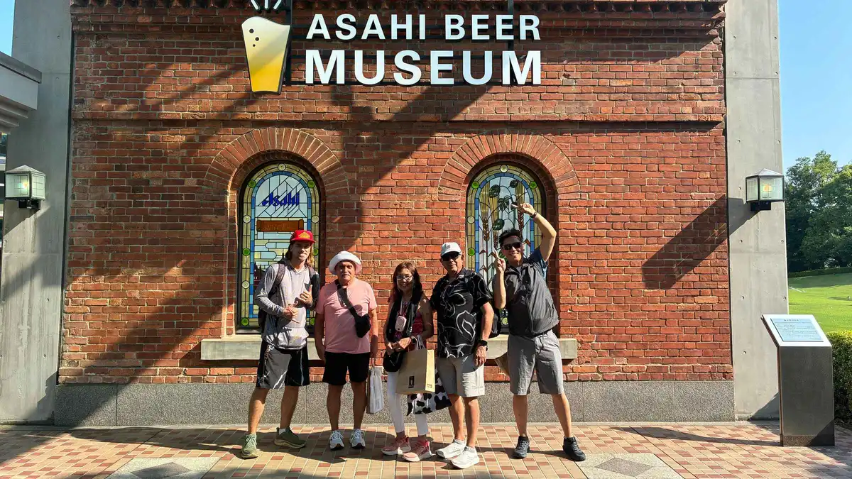 Freshly poured Asahi beer at the tasting counter on a brewery tour outside Osaka, Osaka Japan
